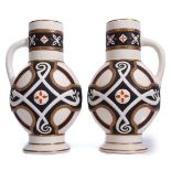 Pair of late 19th century vases decorated in an aesthetic fashion with snakes on a black ground