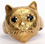 Antique yellow gold cat ring, the naturalistic cat's textured profile set with two small circular