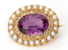 Victorian amethyst, diamond and seed pearl brooch, the oval faceted shaped amethyst within a
