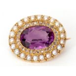 Victorian amethyst, diamond and seed pearl brooch, the oval faceted shaped amethyst within a