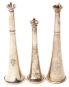 Group of three Victorian novelty table lighters in the form of hunting horns of typical form, one