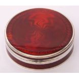 Red guilloche circular lidded powder box, the hinged lid opening to reveal a mirror under, gilt