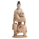 Ivory figure of a lady seated above an elephant, 16cm high