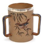 Doulton Lambeth tyg by Florence Barlow, the brown stippled ground finely decorated with birds in
