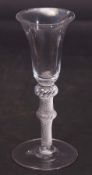 Mid-18th century double knopped wine glass, the bell bowl above a multi-spiral air twist knopped