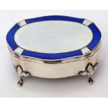 George V silver dressing table ring box of shaped oval form, the lid guilloche enamelled in blue and