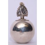 George V table lighter in the form of a grenade with flambeau finial (weighted) bearing a crest,