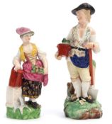 Pair of Derby figures of gardeners, mid 19th century, the figures standing on green rocky bases,