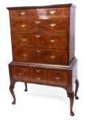 18th century and later walnut and oak chest on stand, cross banded drawers, the upper section with