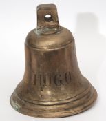 Heavy bronze or cast metal bell of typical form inscribed "Hugo", 30cm high