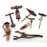 Collection of various corkscrews and other wine ephemera including stoppers, tap, novelty items