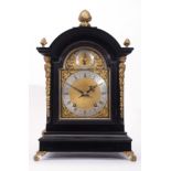 Late 19th century ebonised cased bracket clock, the arched gilt metal dial with fast/slow