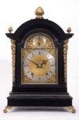 Late 19th century ebonised cased bracket clock, the arched gilt metal dial with fast/slow