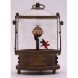 Unusual automaton clock of brass mounted cylindrical form, the glazed cover etched with fish, also