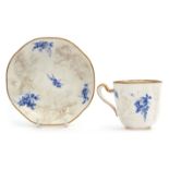 18th century Sevres cup and saucer with a blanc de chine moulding of flowers interspersed with a