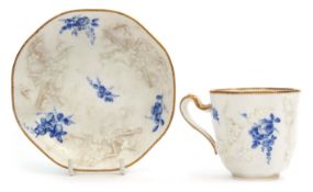 18th century Sevres cup and saucer with a blanc de chine moulding of flowers interspersed with a