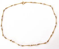 Antique yellow metal and seed pearl necklace, the design of cylindrical bars joined by circular