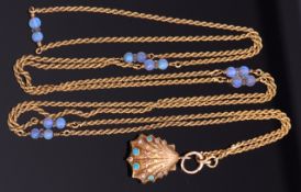 Early 19th century tri-coloured gold clam shell locket and opal set chain, the locket set both sides