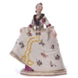 Nymphenburg porcelain Commedia dell'Arte figure designed by Franz Bustelli of a lady in flounced