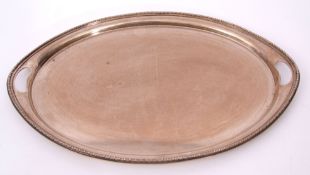 Large and heavy George V oval tea tray with beaded edge, two in-cut handles, plain centre, 39cm x
