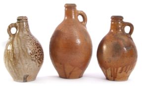 Collection of three stoneware flagons, the earliest probably 17th century with an orange peel