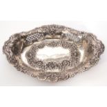 Late Victorian table dish of shaped oval form, pierced and embossed with foliate and roundel