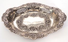 Late Victorian table dish of shaped oval form, pierced and embossed with foliate and roundel