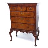 18th century oak and walnut chest on stand, the upper section with three short and three full