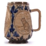 Doulton Lambeth mug with incised decoration by Hannah Barlow with three oval panels decorated with