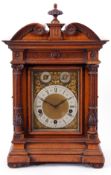 Late 19th century large German oak cased bracket clock, the gilt metal dial with black Roman