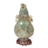 19th century Chinese green quartz vase and cover, the vase with scroll handles and a carved floral