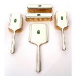 Elizabeth II cased dressing table set, white guilloche backed and each featuring a small jadeite