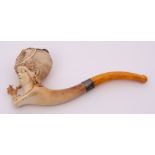 Meerschaum pipe the bowl carved in the form of a lady wearing an eye patch clutching a cheroot in