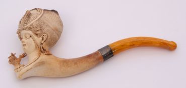 Meerschaum pipe the bowl carved in the form of a lady wearing an eye patch clutching a cheroot in