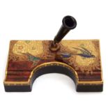 1930s Carltonware pen holder, the ruby ground with a gilt design of a bird amongst clouds,