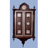Moorish hardwood wall cabinet inlaid with mother of pearl detail throughout and applied with ring
