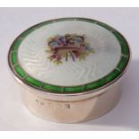 Edwardian small circular lidded box, the push on lid with guilloche enamel top, the centre featuring