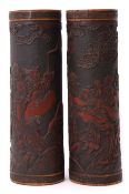 Pair of 19th century carved bamboo brush pots, carved in relief with Chinese deities, 37cm high