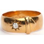 Antique 18ct gold and diamond buckle ring, featuring an old cut diamond in a star engraving setting,