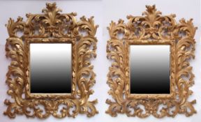 Pair of good quality reproduction gilded wall mirrors with floral scroll surrounds, 94cm high x 80cm