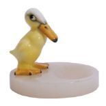 Royal Doulton model of a novelty duck mounted on an onyx ashtray, the duck with factory mark to