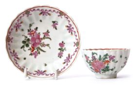 Lowestoft tea bowl and saucer circa 1780, the ribbed body with a floral design, saucer 12cm diam