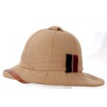 Mid-20th century British pith helmet with RAF colours flash to band, inscription on leather band "
