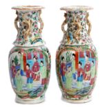 Pair of 19th century Cantonese famille rose vases decorated in typical fashion with Chinese