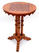 Burr walnut or satinwood circular pedestal games table inlaid with chequerboard top over three