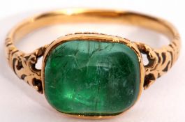 Georgian cabochon emerald ring, bezel set in an enclosed basket mount and raised between pierced