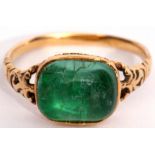 Georgian cabochon emerald ring, bezel set in an enclosed basket mount and raised between pierced