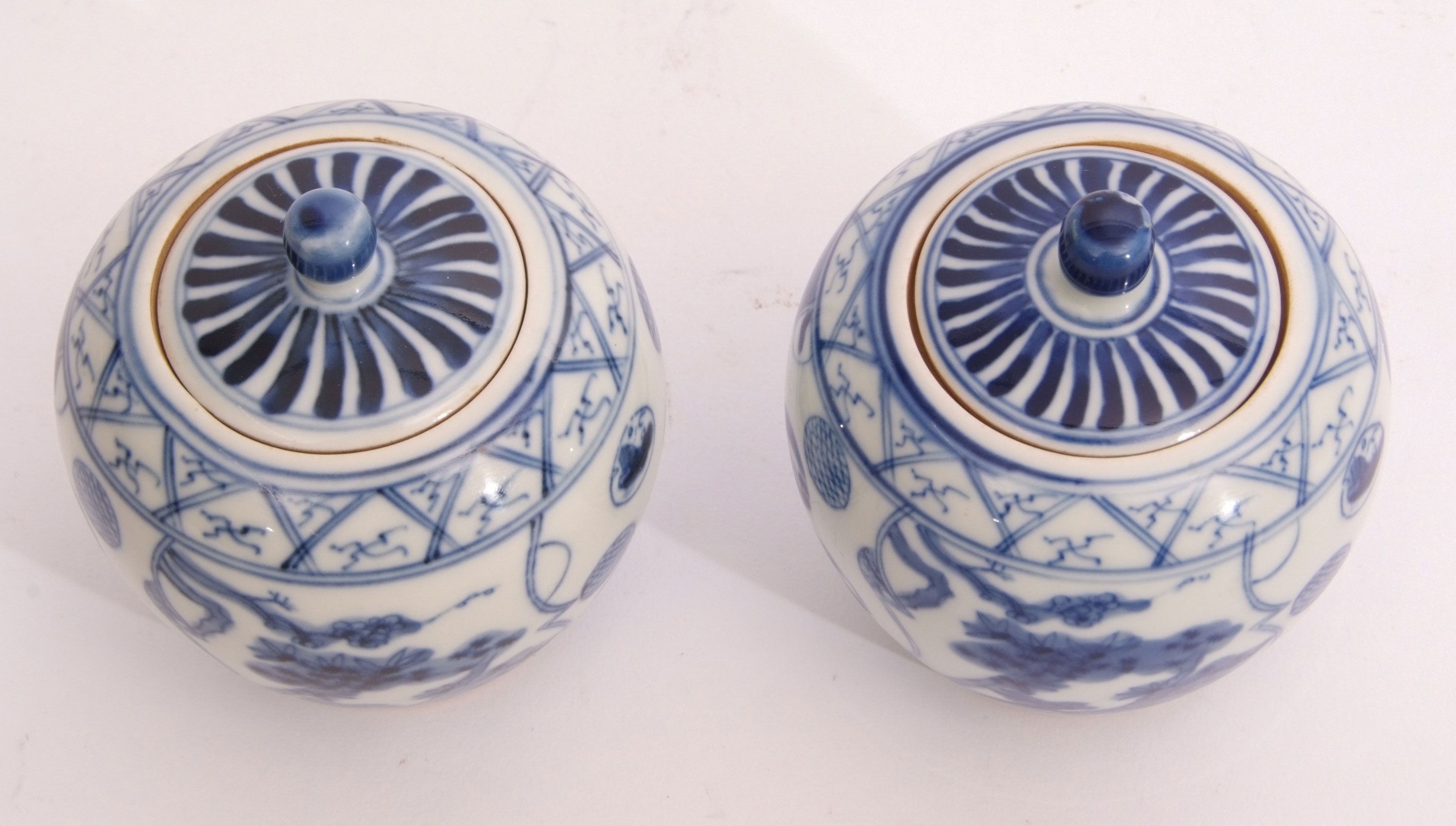 Two Chinese jars with covers, decorated with a blue and white design, six character mark to base, - Image 5 of 6