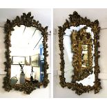 Pair of ornate gilded rectangular wall mirrors, oak leaf and acorn surrounds and further ribbon
