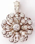 Victorian diamond brooch/pendant of a Catherine Wheel design, the old brilliant cut diamond centre